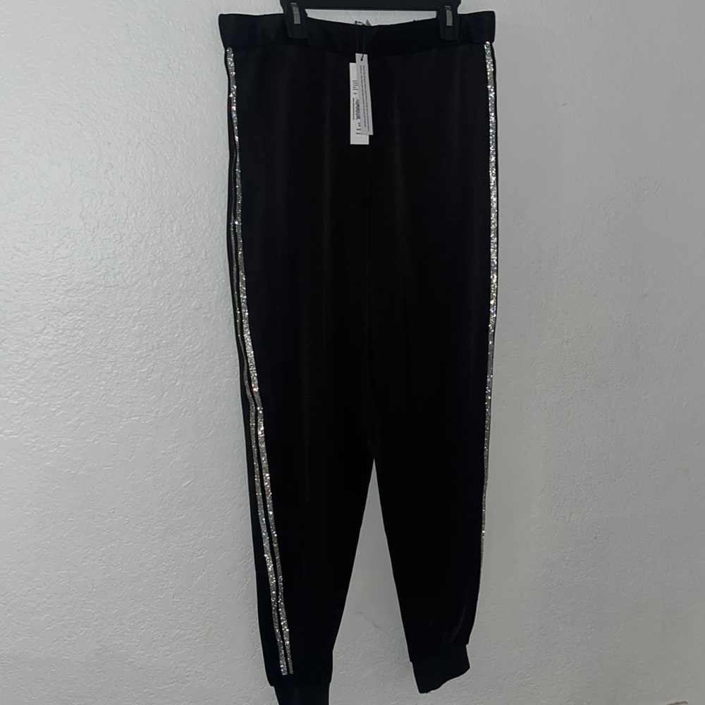 Stylish Alice + Olivia black joggers with rhinestone stripes on the side